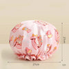 Pink reusable waterproof shower cap with a floral pattern and bow detail