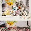 Vintage botanical washi tape in shades of green and gold used for scrapbooking and journaling