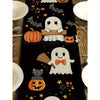 Black Halloween table runner featuring pumpkins, bats, jack-o'-lanterns, and a cat design.