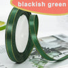 Roll of blackish green satin ribbon with gold edge for crafts and decor