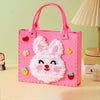 Pink felt bag with a white rabbit face design and pink handles for a sewing craft kit