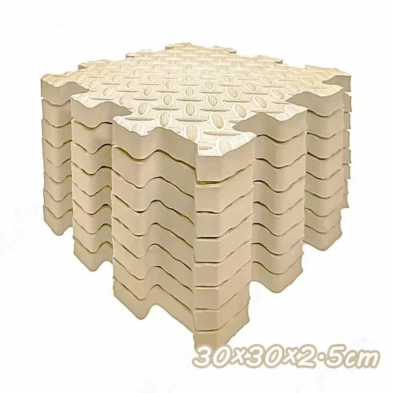 A stack of interlocking foam play mats for babies and toddlers, showing the textured surface and layered construction.