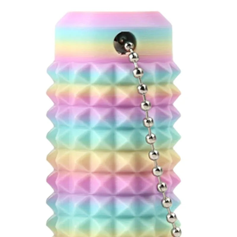 A stack of colorful, spiky fidget keychains in pastel shades of pink, blue, and green.