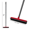 A black rubber broom and carpet rake with an adjustable handle and a red cleaning head.