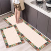 A rectangular beige floor mat with an ornate border is placed on a light wood floor.
