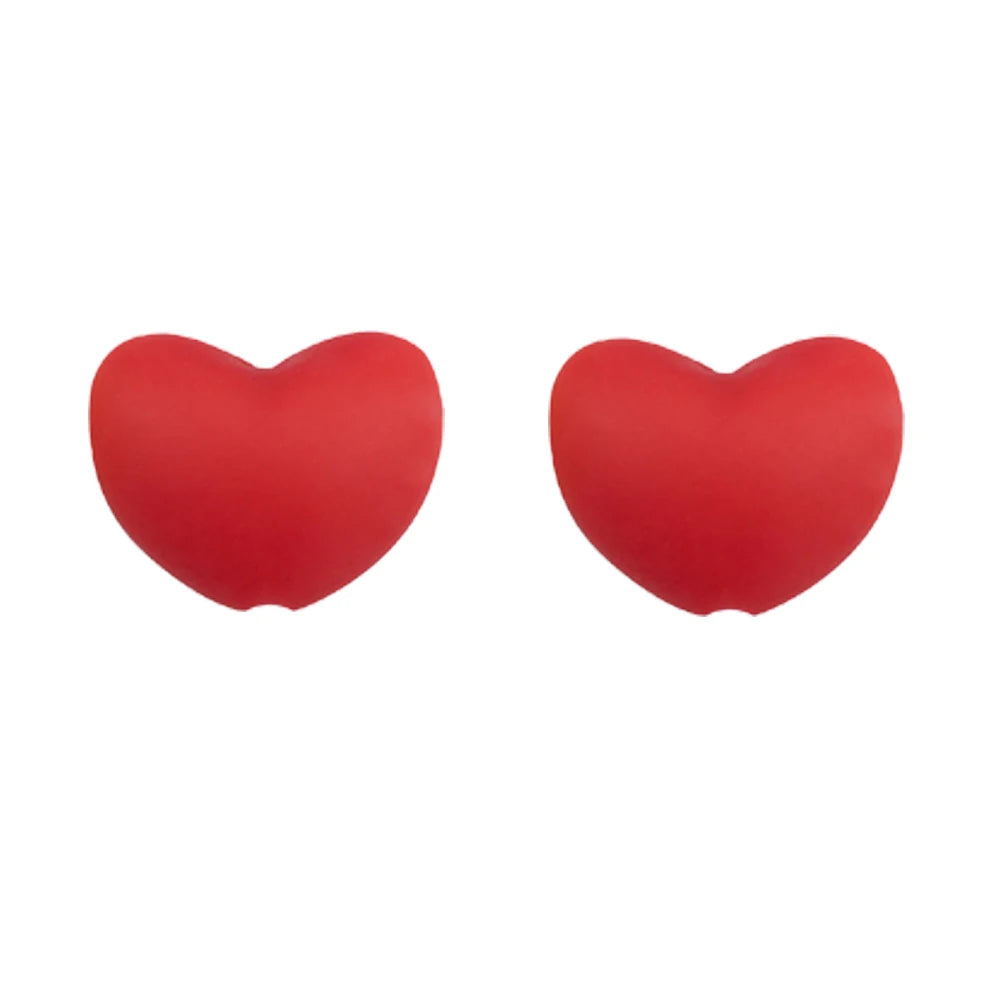 A pair of bright red silicone heart beads for DIY jewelry making