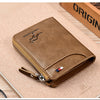 A brown leather wallet with a zipper and a logo is shown resting on a light wooden surface.