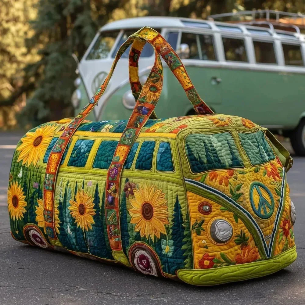A quilted travel duffle bag featuring vibrant floral and nature patterns, carried by fabric handles.
