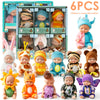 A collection of six mini reborn baby dolls with various outfits and accessories displayed in a box.