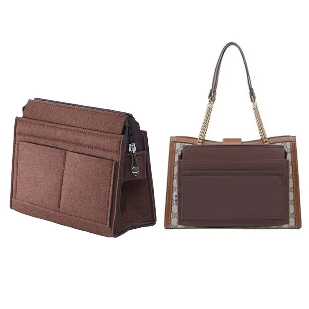 A brown felt multi-pocket purse organizer insert with a leather strap and gold chain detail.