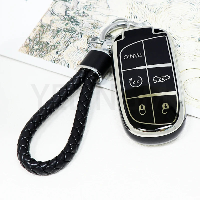 A black durable TPU car key fob cover with a chain attached, featuring panic and lock buttons.