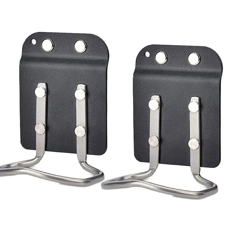 A black clip-on tool belt holster with metal clips for securing drills and power tools.