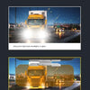 A yellow truck with high beam headlights glaring on a road at night.