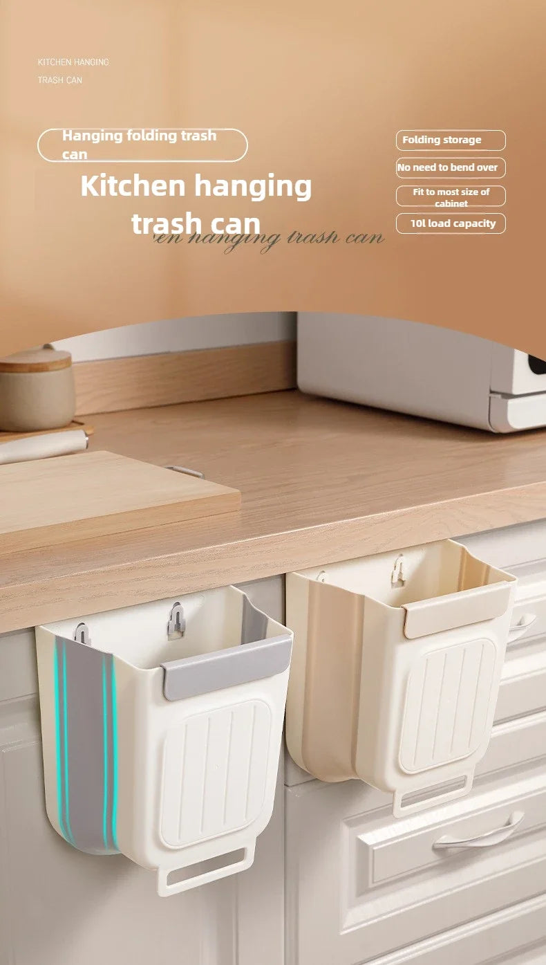 A set of white folding hanging trash cans displayed on a kitchen cabinet shelf.