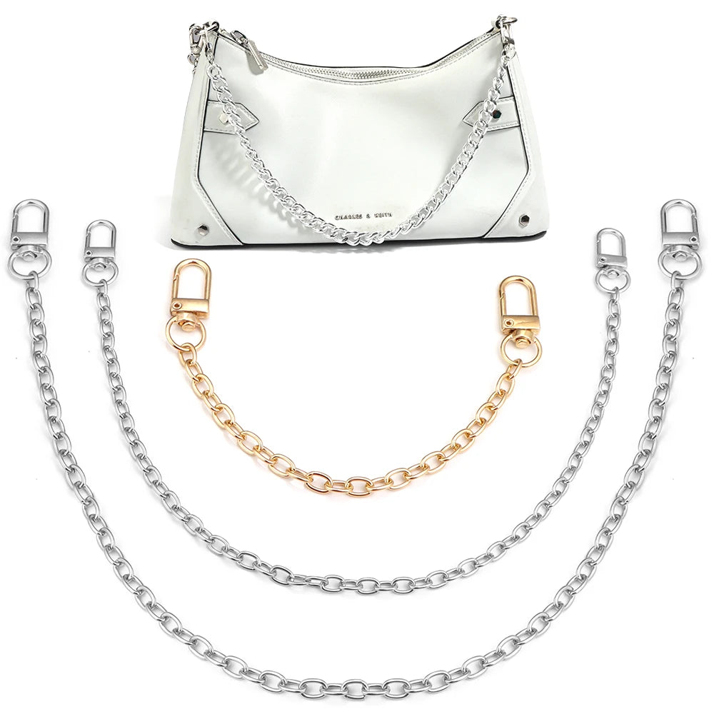 White leather handbag with silver chain strap and matching metal shoulder straps
