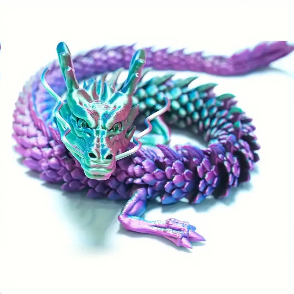 A purple and teal articulated dragon figurine coiled in a ring.