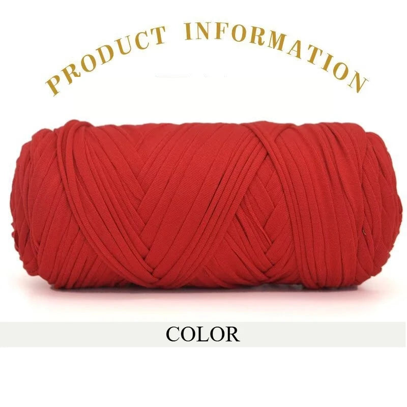 A skein of bright red thick polyester blend yarn coiled for knitting and crochet.