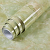 Roll of waterproof self-adhesive marble wallpaper in a light green and beige marbled pattern