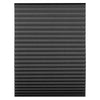 Close-up view of dark gray pleated window blinds with adjustable clips.