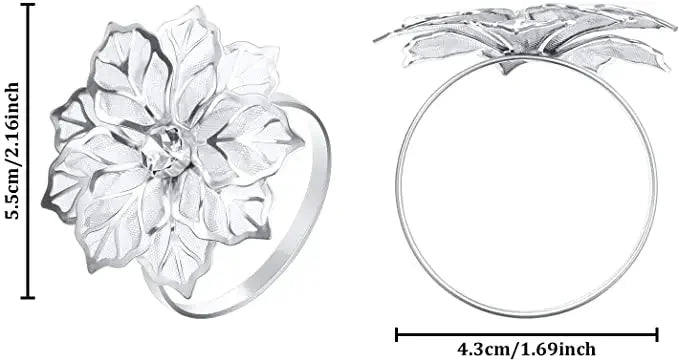 Silver decorative metal napkin rings featuring a detailed flower pattern and a smooth circular design.