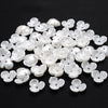 A pile of 100 white acrylic pearl spacer beads for jewelry making