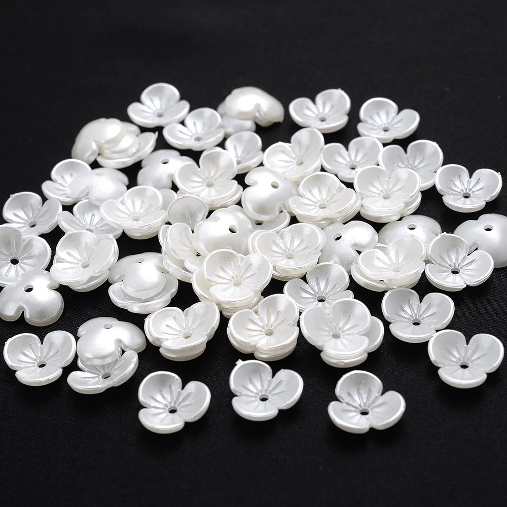 A pile of 100 white acrylic pearl spacer beads for jewelry making