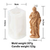 A light brown silicone mold for crafting a religious candle and resin figure.