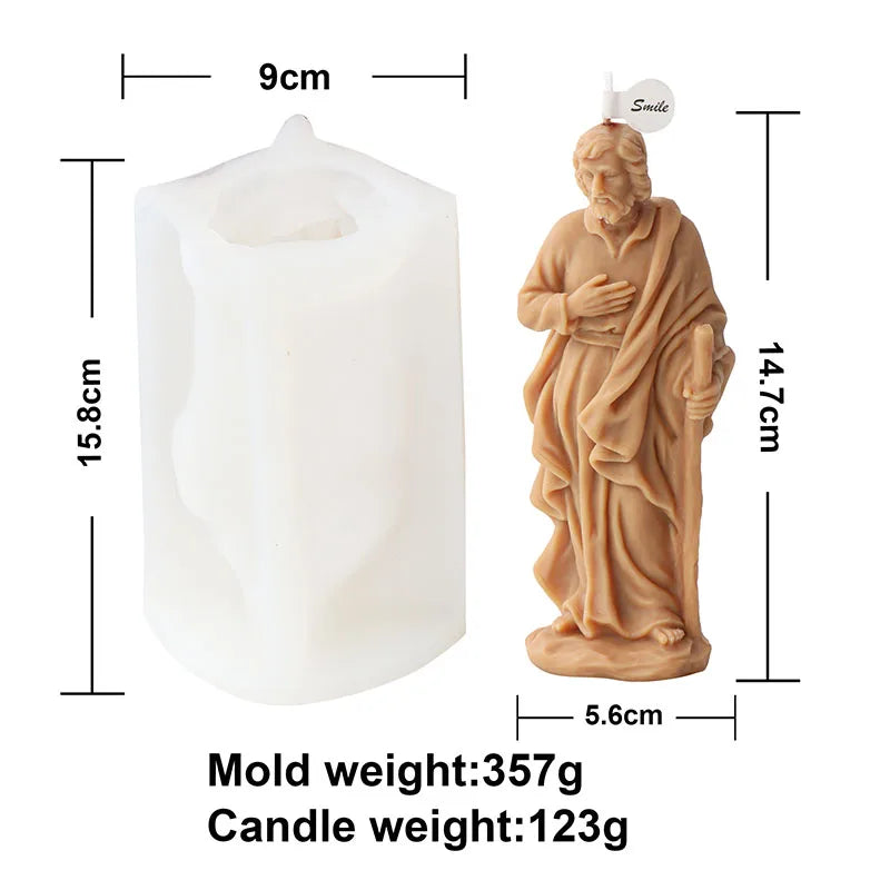 A light brown silicone mold for crafting a religious candle and resin figure.
