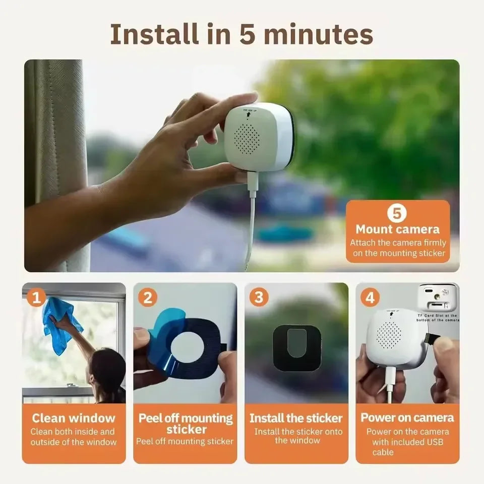 Hands install a small white security camera onto a window using a mounting sticker.