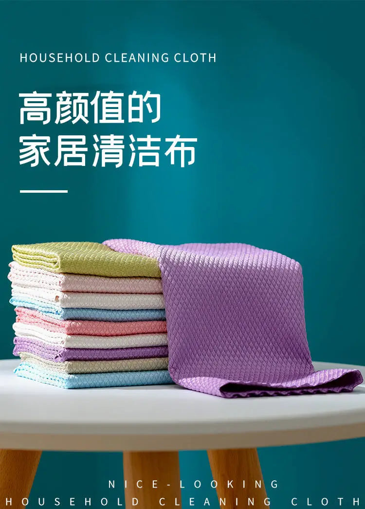 A stack of purple and green lint-free microfiber household cleaning cloths on a white table.