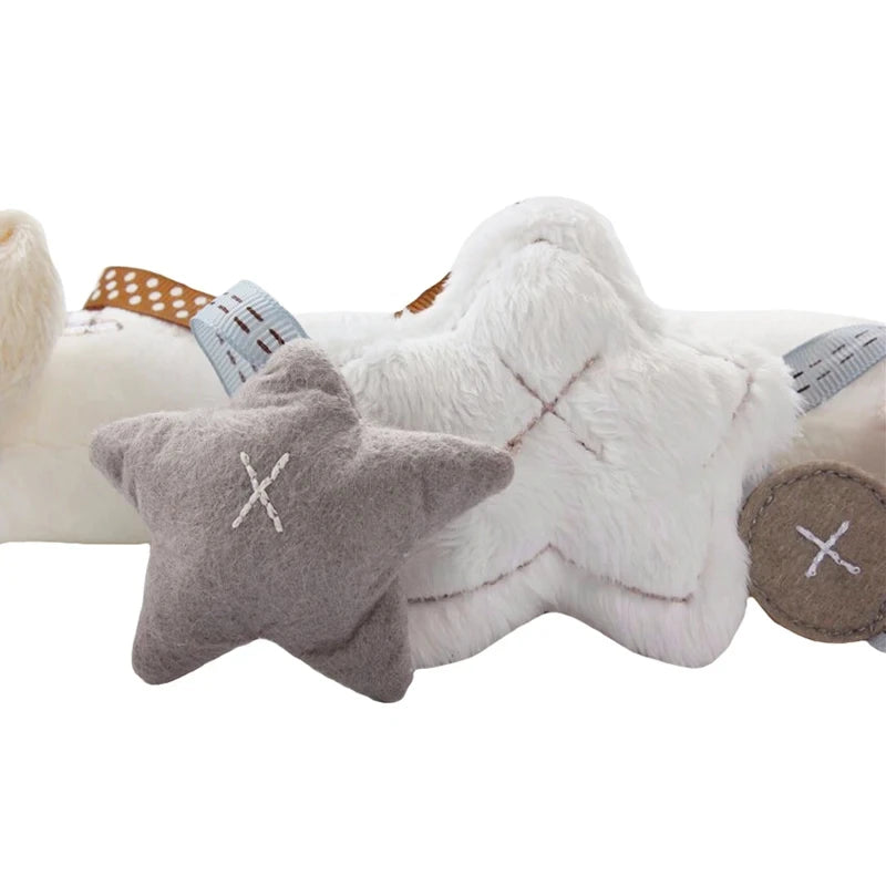 A soft gray star-shaped plush toy is shown next to a white fluffy bunny toy.