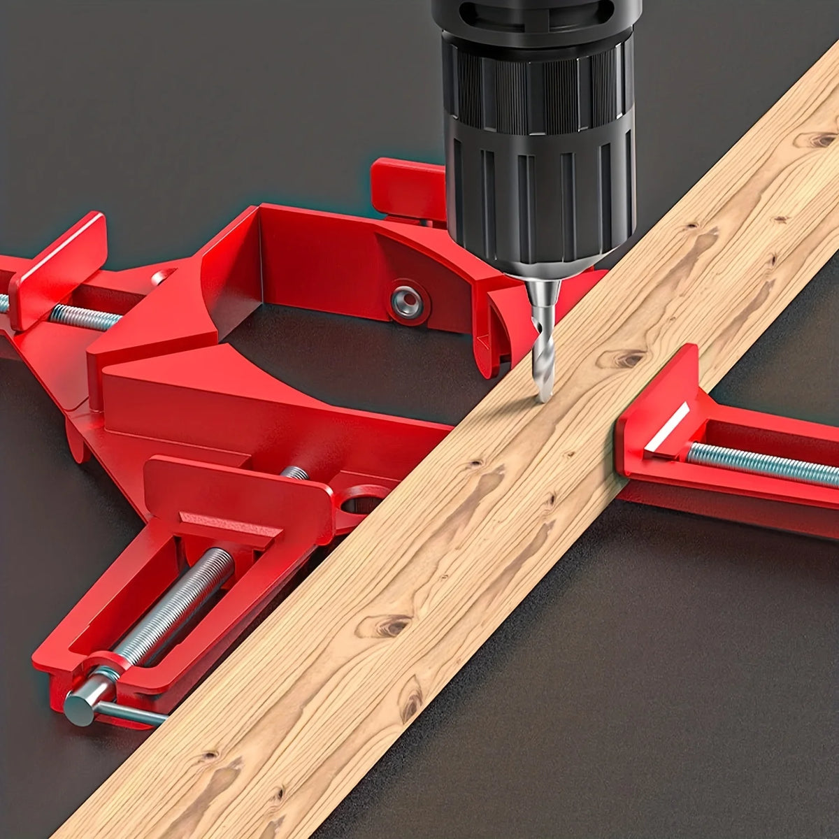 A red 90 degree right angle clamp is used to secure a piece of light wood for DIY projects.