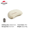 A beige inflatable camping pillow and a storage bag are shown for outdoor use.