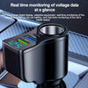 A black digital display device for real-time monitoring of voltage data, shown in a close-up on a car interior surface.