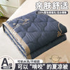 A navy blue quilted blanket folded on a white surface, labeled as an ultra-light breathable summer quilt.