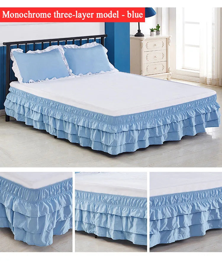 Blue monochrome three-layer bed skirt with ruffled edges covering a white mattress.