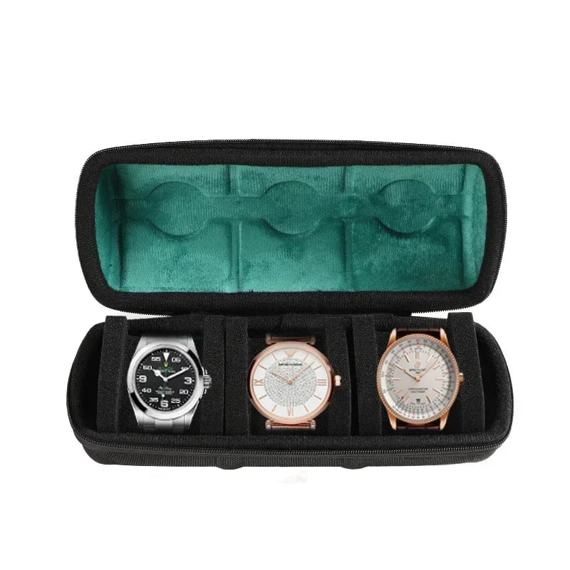 A black watch travel organizer case with a green velvet lining holding three watches.