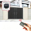 A hand holds a remote control for a universal garage door opener receiver with rolling code technology.