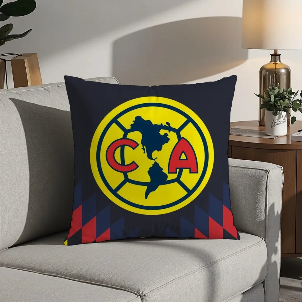 A navy blue decorative pillow featuring a yellow circular logo with the letters CA and a map outline of North America.