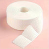A roll of white lint-free cotton rounds for nail care