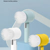 Three cordless electric cleaning brushes in green, white, and yellow are displayed on a light blue surface.