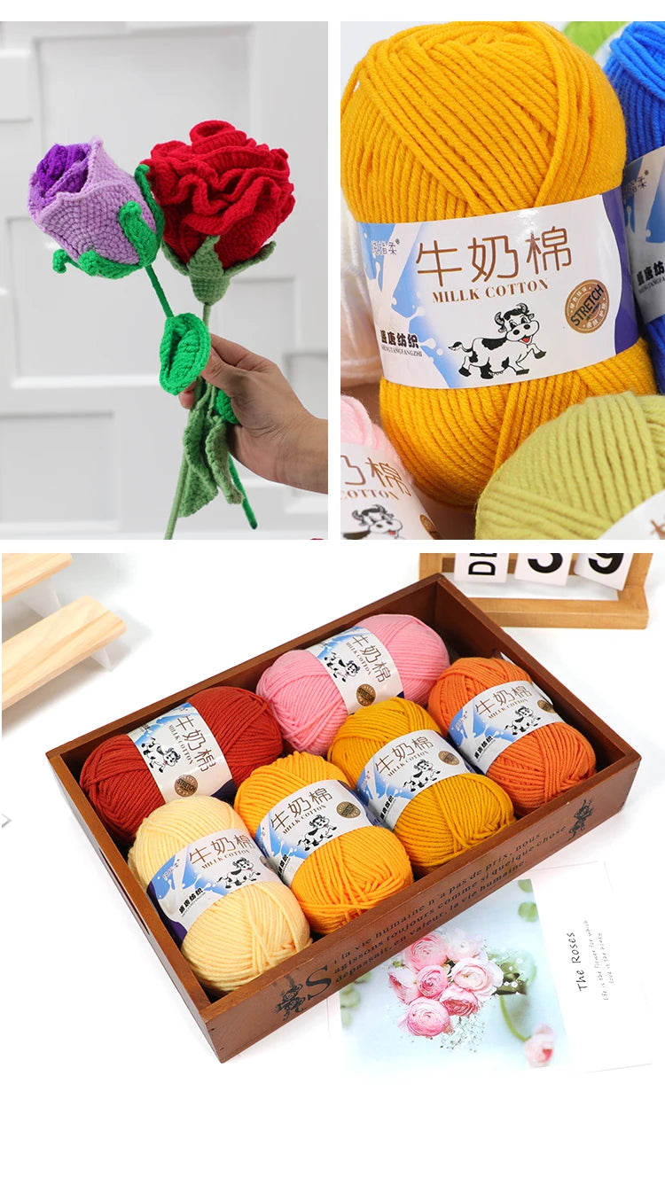 A collection of yellow and pink milk cotton blend yarn skeins displayed in a wooden box.