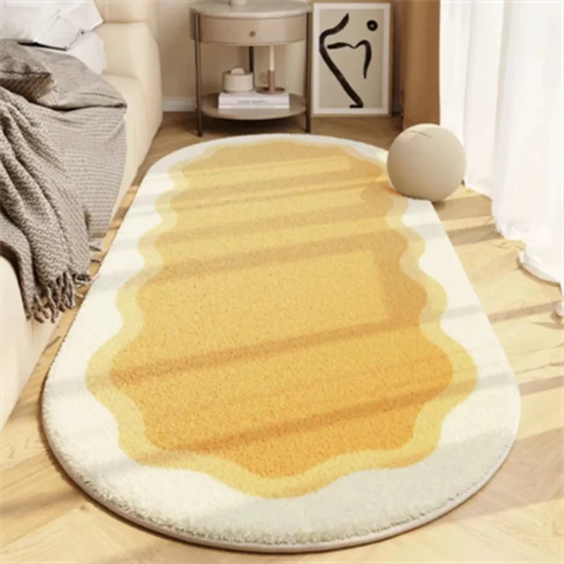 A beige and cream decorative area rug with striped patterns placed on a light wooden floor.