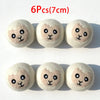 Six natural wool dryer balls with a light beige color are displayed on a white background.