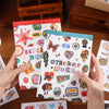 Hands hold an aesthetic nature sticker book with various patterns for scrapbooking and DIY