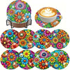 A colorful diamond painting coaster set featuring floral patterns and a latte art coffee cup with foam design.