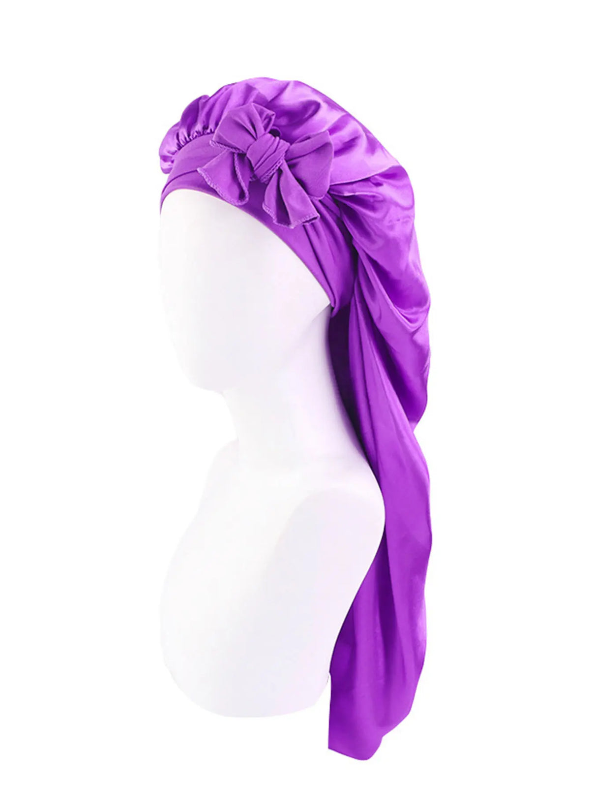 Purple satin sleep bonnet with an adjustable tie draped over a white mannequin head.