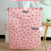A series of pink patterned laundry bags in various sizes, labeled S, W, L, and XL, displayed on a wooden floor.