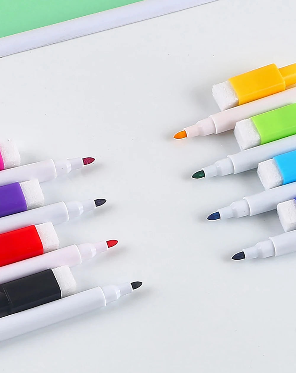 An assortment of eight fine tip whiteboard markers in various colors, including yellow, green, blue, red, and black.