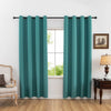 A teal curtain hanging in a window frame with a dark wooden dresser and chair visible.